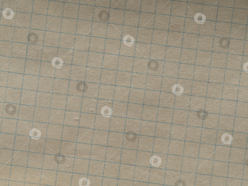 Скачать Фон с текстурой бумаги - Макрофотография тетрадного листа бумаги в клетку фотосток Ozero