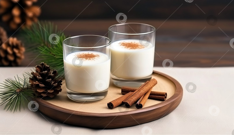 Скачать Рождественский молочный напиток со специями, гоголь-моголь, в стеклянных бокалах, праздничное настроение. Искусственный интеллект сгенерирован. фотосток Ozero