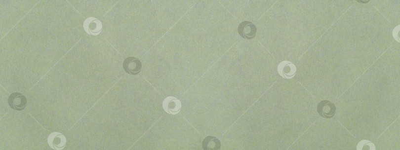 Скачать Зеленый фон из текстурированной бумаги. Светло-зеленый бумажный материал, похожий на мрамор, с текстурой для фона фотосток Ozero