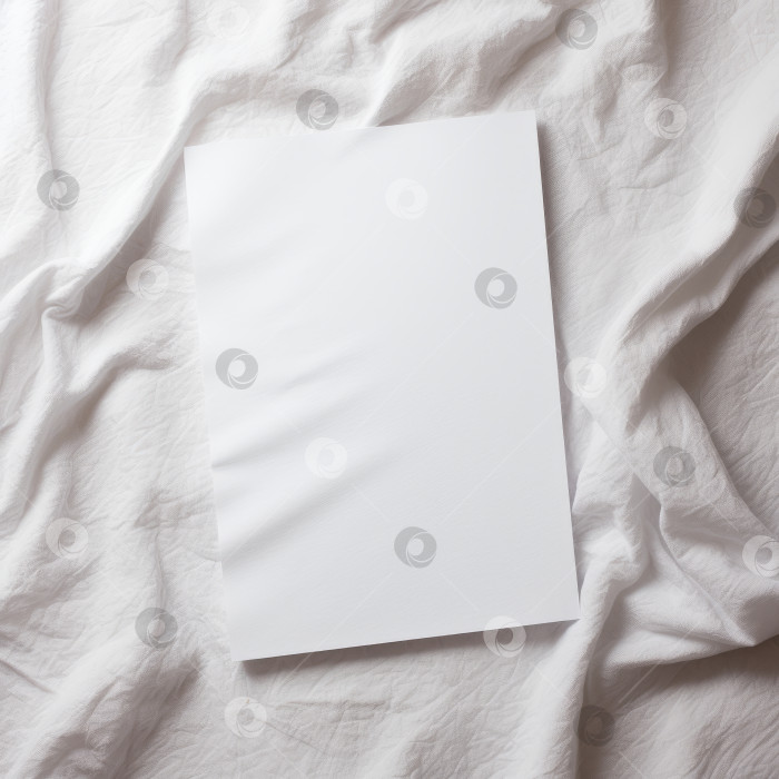 Скачать Чистый белый лист бумаги на белой ткани фотосток Ozero