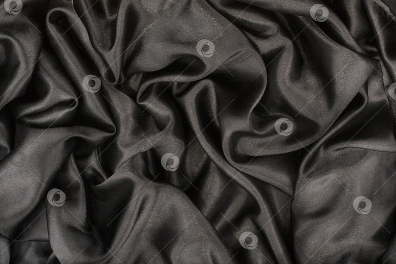 Скачать Черная шелковая мятая ткань в качестве фона. Black satin as background фотосток Ozero