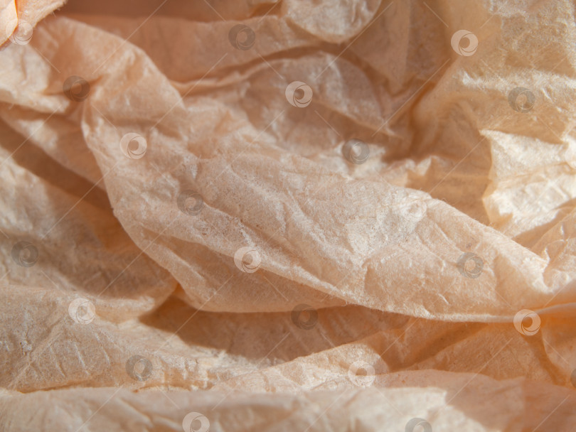 Скачать Текстура фона из мягкой мятой бумаги бледно-персикового цвета фотосток Ozero