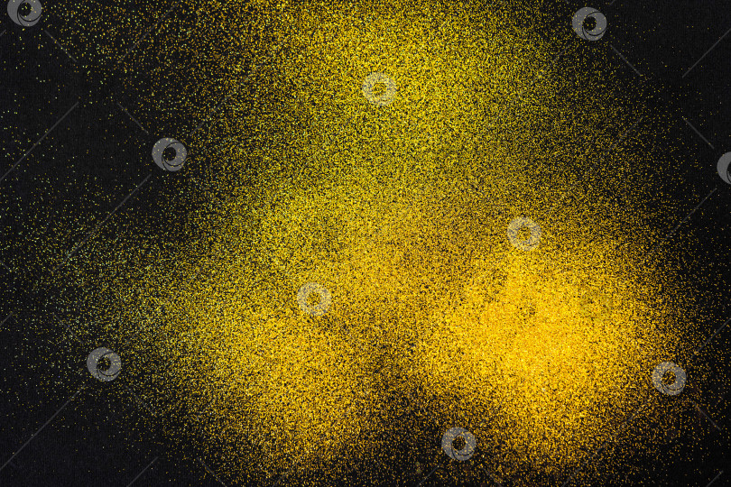 Скачать Минималистичная текстура золотистого песка на черном фоне фотосток Ozero
