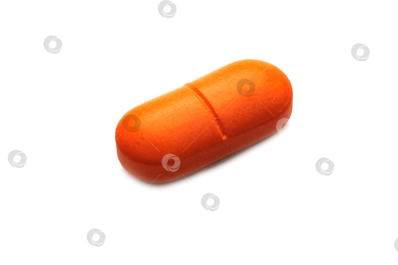 Скачать Одна оранжевая таблетка крупным планом, изолят на белом фоне фотосток Ozero