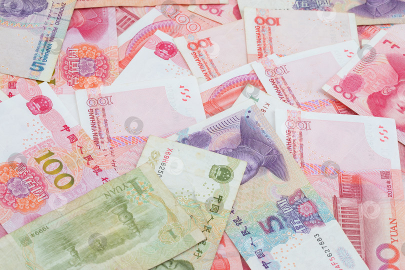 Скачать бумажные банкноты различного достоинства, китайский юань, бизнес и финансы фотосток Ozero