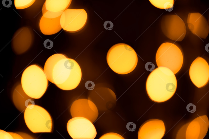 Скачать Ярко-желтый, золотые блики, боке на черном фоне фотосток Ozero