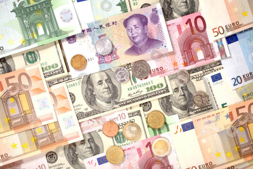Скачать Фон банкнот и монет в долларах, евро и юанях фотосток Ozero