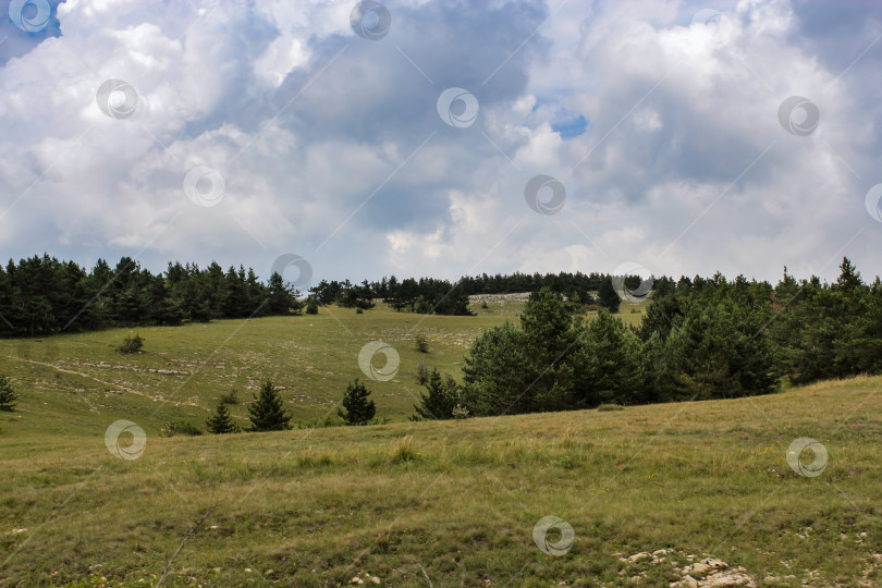 Скачать Облака над холмами. фотосток Ozero