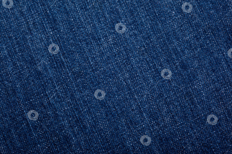 Скачать Деталь из джинсовой ткани с текстурой синих джинсов. фотосток Ozero