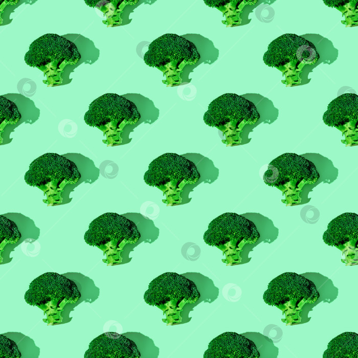 Скачать Бесшовный растительный узор с брокколи на зеленом фоне. фон, здоровое питание, вегетарианство фотосток Ozero
