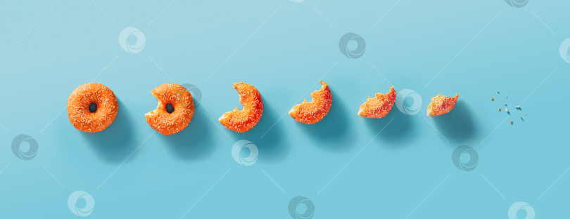 Скачать Этапы поедания пончика, синий фон, вид сверху фотосток Ozero